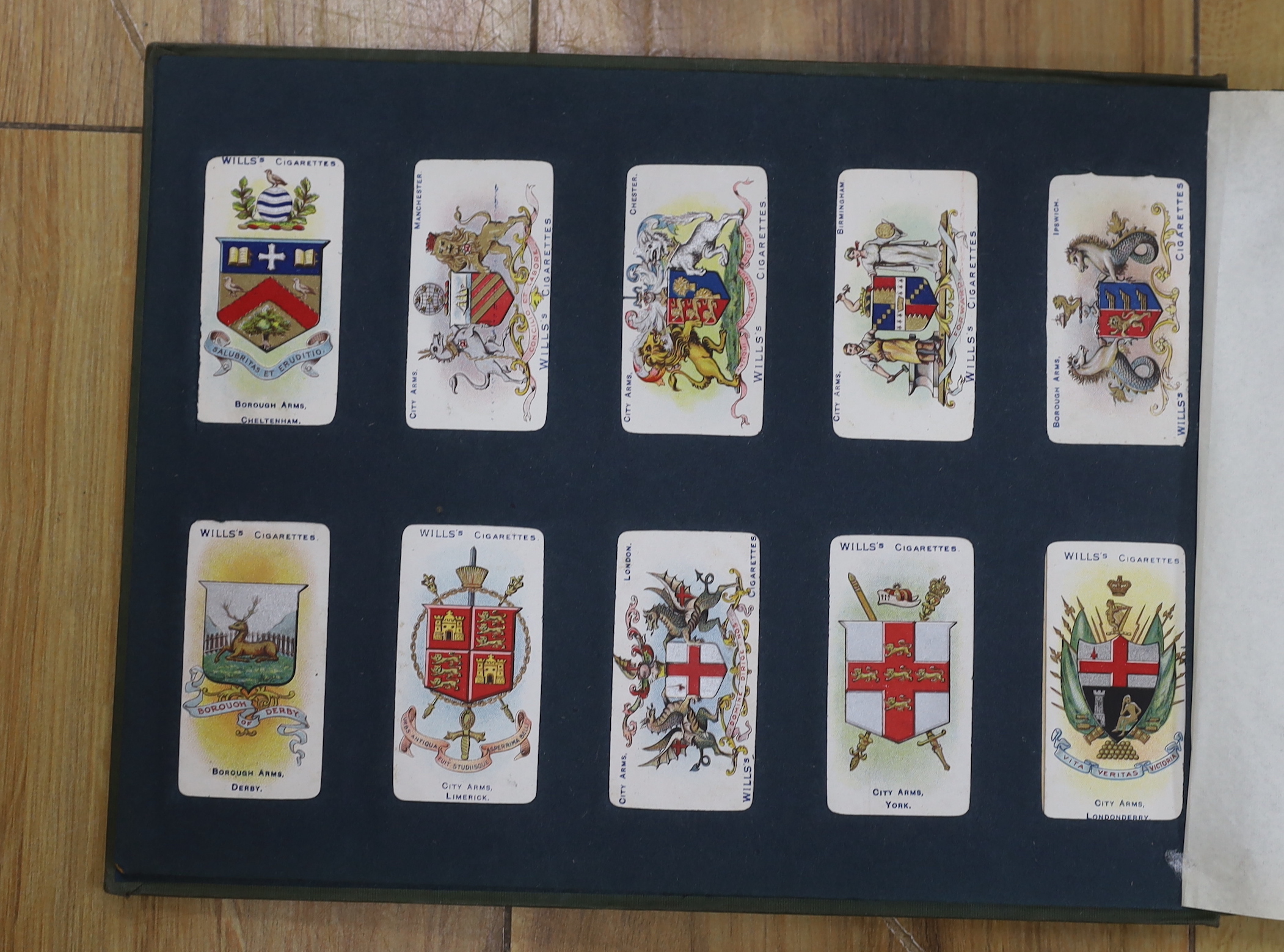 A collection of cigarette cards in albums